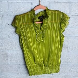 B wear green sheer sleeveless top, with tank under it included pp19. L29